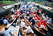 Boats pass throuch lock before traditional "Swan Upping" on River Thames, Henley, Oxfordshire, UK