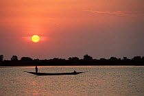 Fisherman on Niger river at sunset, Mali, West Africa