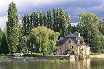 Restored mill house on River Sarthe, France