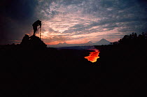 Bruce Davidson filming lava flow from Kimanura volcano. Democratic Republic of Congo (formerly Zaire) Virunga NP