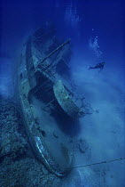 Diver exploring wreck of 'Ora Verde' Grand Cayman, Caribbean   Model released.