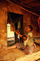Woman weaving basket, Palawan, Philippines