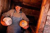 Shepherd with cheeses, Carpathian mtns, Transylvania, Romania