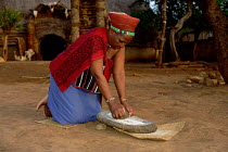 Zulu woman grinding corn Natal, South Africa