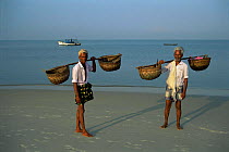 Fishermen on Kappat beach, Calicut, Kerala, India