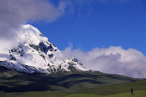 Quicha Indian riding on the Paramo, Mount Antisana behind, Andes, Ecuador