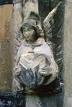 Corrosion to stone statue on church, resulting from acid rain, indicative of atmospheric pollution, Surrey, UK