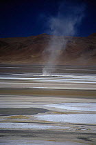 Dust devil spinning across dry Salar Pujsa, Atacama Desert, Chile