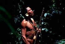 Matis hunter in forest Javari valley, Amazonia Brazil. NB facial decorations mimic jaguar