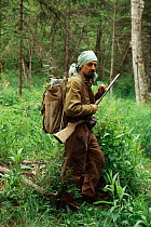 Hunter with gun out in forest, Birkin river, Primorsky, Russia 1995 (Ussuriland).