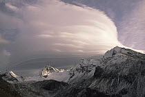 Lenticular clouds forming over the Italian Alps