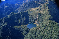 Aerial view of lake amongst tree covered mountains, Peru, South America  2000