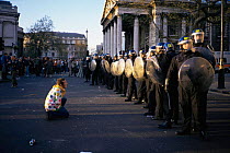 'Reclaim the streets' demonstrator confronting police. London, UK, April 1997
