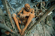 Enga 'Smoked bodies' of men under cliff Aseki, Papua New Guinea, 1991