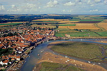 Aerial view of saltmarshes and village, Wells next the Sea, Norfolk, UK