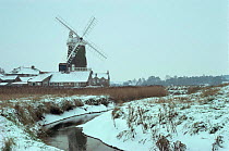 Cley windmill and marshes in snow, Norfolk, UK