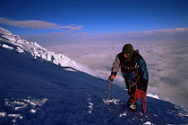 Climber on Cotopaxi volcano, above cloud level, Ecuador