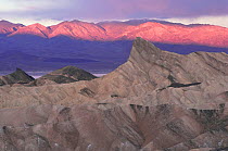 Zabrieski / Zabriski point at sunset with Panmint Mountains behind, Badlands, Death Valley NP, California, USA