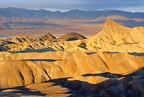 Zabriskie point with Panmint mountains behind, Badlands, Death Valley NP, California, USA