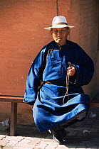 Mongolian monk with string of beads, Gandantegchinien monastry Ulaanbaatar, Mongolia. 2001