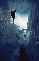 Scientist in ice cave, Signy Island, Antarctica