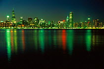 Chicago city at night, lights reflected in river, Illinois, USA