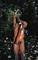 Huaorani indians hunting with blow pipe and curare, Yasuni NP, Ecuador