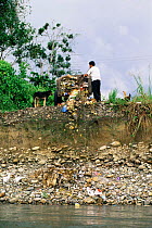 Dumping rubbish into Napo river, Amazonia, Ecuador