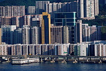 High rise flats and bridgenext to waterfront, Kowloon, Hong Kong, China.