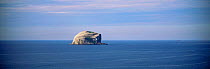 Distant view of Bass Rock, RSPB reserve and home to annual gannet breeding colony, Firth of Forth, Lothian, Scotland
