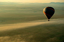 Hot air balloon over Masai Mara Game Reserve savanna, ecotourism, Kenya East Africa