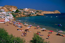 Beach scene with holidaymakers San Juan Terreros, Almeria, Spain