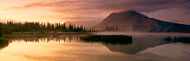 Panoramic dawn reflections of Mt Rundle at Vermillion Lake Banff NP Alberta Canada, North America