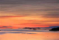 Sunset over the sea and outer Hebrides islands as viewed from Fionnophort, Isle of Mull, Scotland, UK