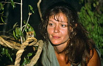 Presenter Charlotte Unlenbroek with Pygmy mouse lemur {Microcebus myoxinus}, on location in Madagascar, filming for BBC television series "Cousins", 1999