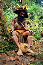 Huli wigman with Cassowary chick, Papua New Guinea 1992