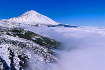 Teide volcano landscape in snow and clouds, Tenerife, Canary Islands, Spain