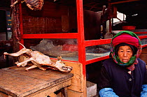 Dead Dog for sale as food at market, Zhongdian (Tibetan area) Yunnan, China