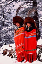Red panda fur hats worn by Yi people (ethnic minority) in winter. Lijiang, Yunnan, China. 2002