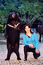 Asiatic black bear performing for tourists {Ursus thibetanus} Xishuangbanna, Yunnan, China. 2002