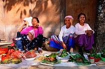 Dai people at market Xishuangbanna, Yunnan, China - minority Buddhist group, wear colourful clothes and long skirts 2001