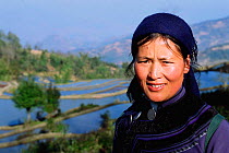 Hani woman wears dark embroidered clothing. Yuanyang, Yunnan, China. 2001