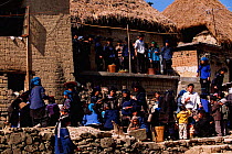 Hani group, communal eating near Grand terraces. Yuanyang, Yunnan, China 2001. Hani wear dark embroidered clothing