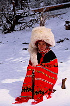 Nosi yi woman wears white fox hat (not traditional Red panda) Lijiang mtns, Yunnan, China 2002