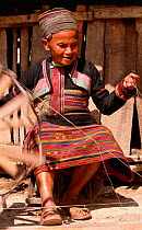 Yuayao woman weaving embroidered winter dress  Xishuangbanna, Yunnan, China 2002