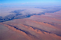 Aerial view of linear sand dunes and river, Skeleton coast  Namibia