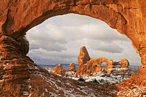 Turret Arch as seen through Window Arch in winter, Arches National Park, Utah, USA