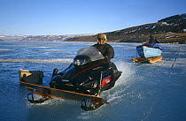 Doug Allan driving skidoo near Arctic Bay, Nunavut, Baffin Island, Canadian Arctic, June 2000