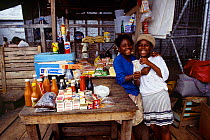 Two girls at market stall, Georgetown, Guyana, South America