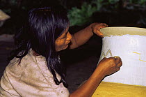 Zaparo indian woman painting ceramic pot, Llanchamacocha, Ecuadorian Amazon South America